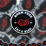 A pile of Born Free Let's Ride stickers.