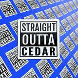 A pile of Straight Outta Cedar stickers. 