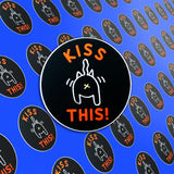 A pile of Kiss This stickers. 