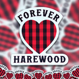 A pile of Forever Harewood stickers. 