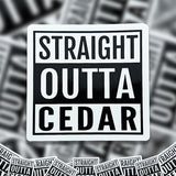 A pile of Straight Outta Cedar stickers. 