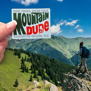 A Mountain Dude sticker on a mountain top. 