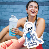 A Stay Fucking Hydrated sticker and a young woman working out. 