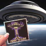 An I Want To Leave sticker in front of a spaceship. 