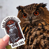 An owl looking at a Real Eyes Realize Real Lies sticker.