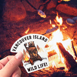 A Vancouver Island Wild Life sticker at a campfire. 