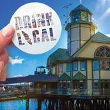 A Drink Local sticker in front of the Lighthouse Bistro in Nanaimo. 