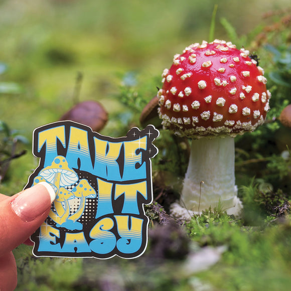 A Take It Easy sticker beside a mushroom. 