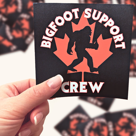 This is a pic of a hand holding a large Bigfoot Support Crew sticker.