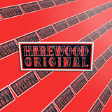 A picture of the Harewood Original sticker against a red background. 